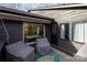 Cozy patio space with outdoor seating, awning, and a view to the interior at 810 Bridgewood Dr, Rock Hill, SC 29732