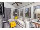 Bright sunroom featuring a comfortable sectional sofa, modern fan and lots of natural light at 810 Bridgewood Dr, Rock Hill, SC 29732