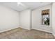 Carpeted bedroom featuring a window with a view and neutral paint at 921 Northeast Dr # 26, Davidson, NC 28036
