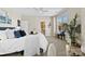 Bright bedroom featuring a large window, a ceiling fan, and ensuite bathroom access at 921 Northeast Dr # 26, Davidson, NC 28036