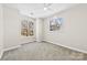 Bright bedroom with two large windows offering natural light and neighborhood views at 921 Northeast Dr # 26, Davidson, NC 28036