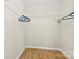 Walk-in closet with wire shelving and wood floor at 921 Northeast Dr # 26, Davidson, NC 28036