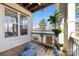 Covered deck with lake view, seating, and charming decor creates a relaxing outdoor space at 921 Northeast Dr # 26, Davidson, NC 28036