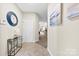 Inviting entryway featuring tile flooring, stylish console table, and artwork leading to the main living area at 921 Northeast Dr # 26, Davidson, NC 28036