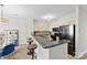 Modern kitchen boasts granite countertops, stainless steel appliances, and a breakfast bar with stool seating at 921 Northeast Dr # 26, Davidson, NC 28036