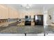 Updated kitchen has granite countertops, stainless steel appliances, a tile backsplash, and a modern faucet at 921 Northeast Dr # 26, Davidson, NC 28036