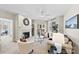 Bright and airy living room features a fireplace, ceiling fan, and access to a balcony with natural light at 921 Northeast Dr # 26, Davidson, NC 28036
