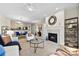 Cozy living room featuring a fireplace, modern furniture, and seamless flow into the dining area and kitchen at 921 Northeast Dr # 26, Davidson, NC 28036