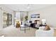 Comfortable living room features a sliding glass door to a deck with plenty of natural light and modern decor at 921 Northeast Dr # 26, Davidson, NC 28036