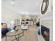 Bright living room and kitchen, with an open layout, feature large windows and comfortable seating near the fireplace at 921 Northeast Dr # 26, Davidson, NC 28036