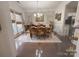 Elegant dining room features hardwood floors, decorative chandelier, and kitchen access at 1004 Canopy Dr, Indian Trail, NC 28079