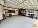 The garage is spacious and clean with mounted cabinets and lots of room at 1004 Canopy Dr, Indian Trail, NC 28079