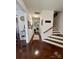 Inviting foyer boasting hardwood floors, staircase and views into the living room at 1004 Canopy Dr, Indian Trail, NC 28079