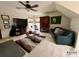 Cozy living room with plush carpeting, a ceiling fan, and natural lighting at 1004 Canopy Dr, Indian Trail, NC 28079