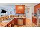 Kitchen with stainless steel appliances, wood cabinets, and a breakfast bar area at 10406 Little Whiteoak Rd, Charlotte, NC 28215