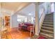 Open floorplan highlighting the living room, dining area, staircase, and a glimpse into the modern kitchen at 10406 Little Whiteoak Rd, Charlotte, NC 28215