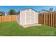 Storage shed in a fenced backyard offers ample space at 10406 Little Whiteoak Rd, Charlotte, NC 28215