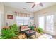 Relaxing sun room with bright light, woven furniture, and a ceiling fan at 10406 Little Whiteoak Rd, Charlotte, NC 28215