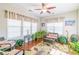 Relaxing sunroom filled with natural light, comfortable seating, and lush greenery, perfect for relaxation at 10406 Little Whiteoak Rd, Charlotte, NC 28215