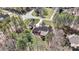 An aerial of a beautiful home surrounded by lush trees, offering privacy at 106 Wolf Hill Dr, Mooresville, NC 28117