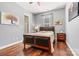 Charming bedroom with wood floors, ample natural light, and calming color scheme at 106 Wolf Hill Dr, Mooresville, NC 28117