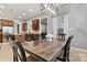 Dining area with a large wooden table, dark wood chairs, and view to the kitchen at 106 Wolf Hill Dr, Mooresville, NC 28117