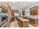 Well-equipped kitchen features an island, stainless appliances, and brick accent wall at 106 Wolf Hill Dr, Mooresville, NC 28117