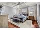 Main bedroom featuring a trey ceiling, ceiling fan, and hardwood floors at 106 Wolf Hill Dr, Mooresville, NC 28117