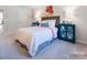 A charming bedroom is decorated with a wooden headboard and teal bedside tables at 1199 Blackburn Cir, Edgemoor, SC 29712