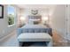 Bright bedroom featuring a gray upholstered bed, soft carpeting, and lots of natural light at 1199 Blackburn Cir, Edgemoor, SC 29712