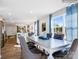 Elegant dining room with a large table, comfortable chairs, and natural light from large windows at 1199 Blackburn Cir, Edgemoor, SC 29712