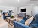 Open-concept living room flowing into the kitchen, featuring modern furniture and abundant natural light at 1199 Blackburn Cir, Edgemoor, SC 29712