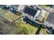 Aerial view of home featuring a well-manicured backyard with patio, fire pit, and fenced yard at 12028 Regal Lily Ln, Huntersville, NC 28078