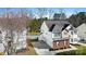 Aerial view of the home with a fenced yard, showcasing its location and surrounding greenery at 12028 Regal Lily Ln, Huntersville, NC 28078