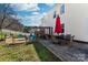 Backyard patio with outdoor seating and a pergola, perfect for entertaining guests at 12028 Regal Lily Ln, Huntersville, NC 28078