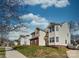 Street view of a two-story home showcasing its unique architecture and landscaping at 12028 Regal Lily Ln, Huntersville, NC 28078