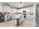 Bright kitchen features white cabinets, a center island, and stainless steel appliances at 12028 Regal Lily Ln, Huntersville, NC 28078