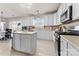 Bright kitchen with white cabinets, stainless steel appliances, and a view to the outside through French doors at 12028 Regal Lily Ln, Huntersville, NC 28078