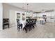 Open kitchen and dining area featuring white cabinets, stainless steel appliances and light hardwood style floors at 12028 Regal Lily Ln, Huntersville, NC 28078