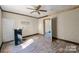 Spacious bedroom with ceiling fan and open doorway at 1216 E Cedar Ave, Gastonia, NC 28054