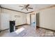 Bright room features a ceiling fan, closet, hardwood floors, neutral paint, and trim at 1216 E Cedar Ave, Gastonia, NC 28054