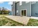 Paver patio with sliding glass doors lead to the home's backyard at 12332 Ridge Cove Cir, Charlotte, NC 28273