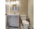 Bright bathroom featuring a vanity with modern fixtures and a toilet at 12332 Ridge Cove Cir, Charlotte, NC 28273