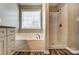 Beautiful bathroom featuring a soaking tub, and a tiled walk-in shower with bronze hardware at 12332 Ridge Cove Cir, Charlotte, NC 28273