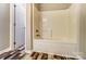 Bathroom featuring a standard white bathtub at 12332 Ridge Cove Cir, Charlotte, NC 28273