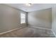 Bright bedroom with neutral carpeting and a window for natural light at 12332 Ridge Cove Cir, Charlotte, NC 28273