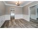 Spacious dining room with chandelier lighting and entryways to other rooms at 12332 Ridge Cove Cir, Charlotte, NC 28273