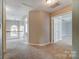 Upstairs hallway featuring carpet flooring and multiple doorways at 12332 Ridge Cove Cir, Charlotte, NC 28273