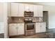 Modern kitchen featuring stainless steel appliances and white cabinetry at 12332 Ridge Cove Cir, Charlotte, NC 28273