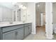 Bathroom featuring double vanity and view into the closet at 1270 Brawley School Rd # E, Mooresville, NC 28177